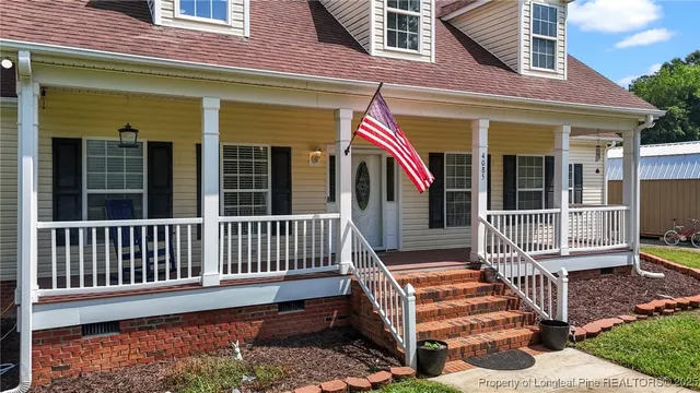 a front view of a house with a porch