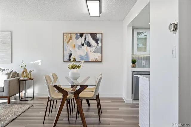 a view of a dining room with furniture and wooden floor