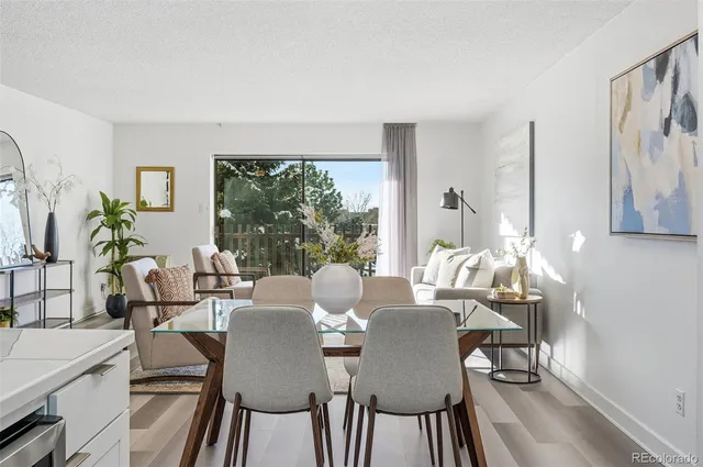 a view of a dining room with furniture window and outside view