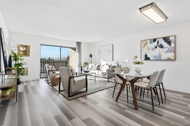 a view of a dining room with furniture window and wooden floor