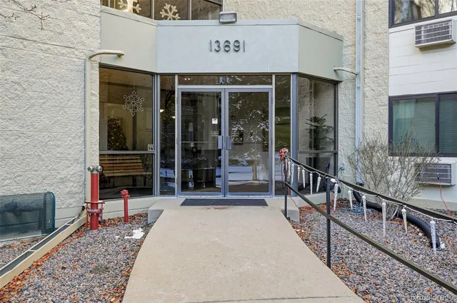 a living room with furniture and flowers