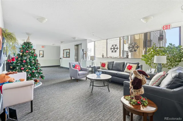 a bed room with furniture and a potted plant