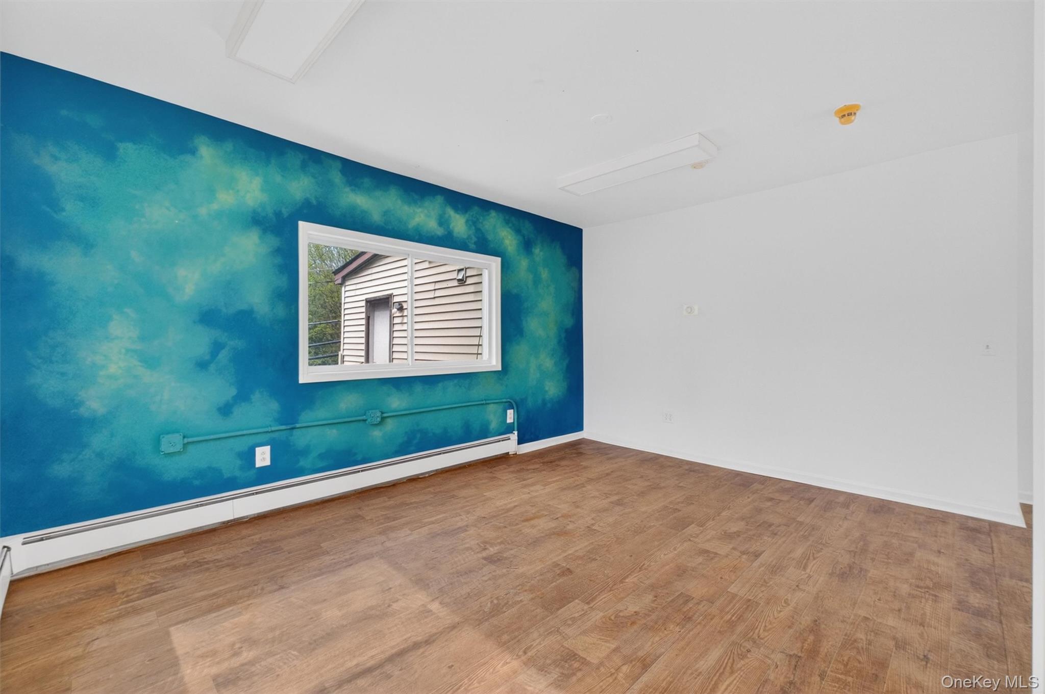 299 Peekskill Hollow Road Putnam Valley, NY 10579 - Photo 17 of 37 an empty room with windows