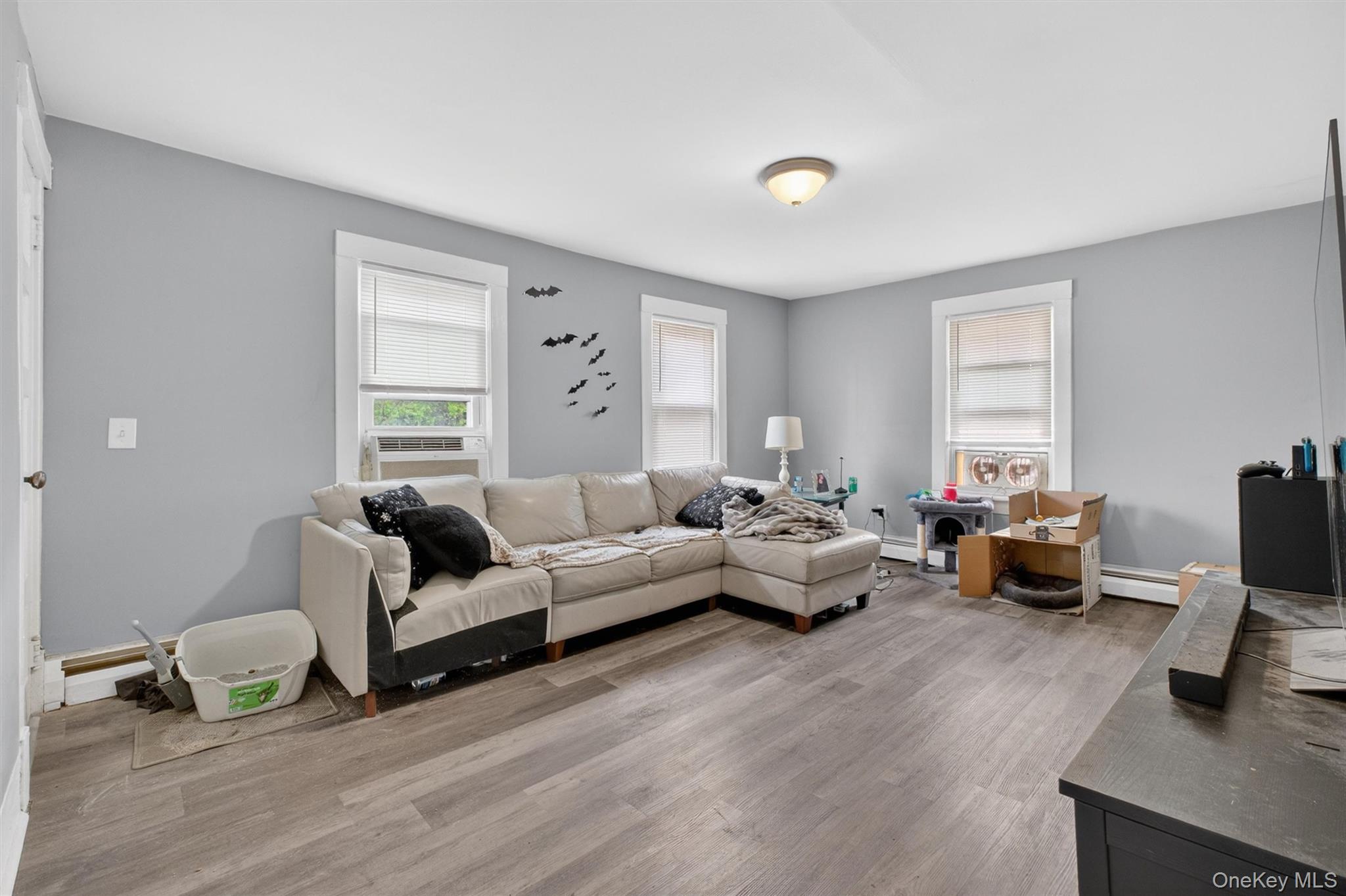 299 Peekskill Hollow Road Putnam Valley, NY 10579 - Photo 23 of 37 a living room with furniture or couch and a wooden floor