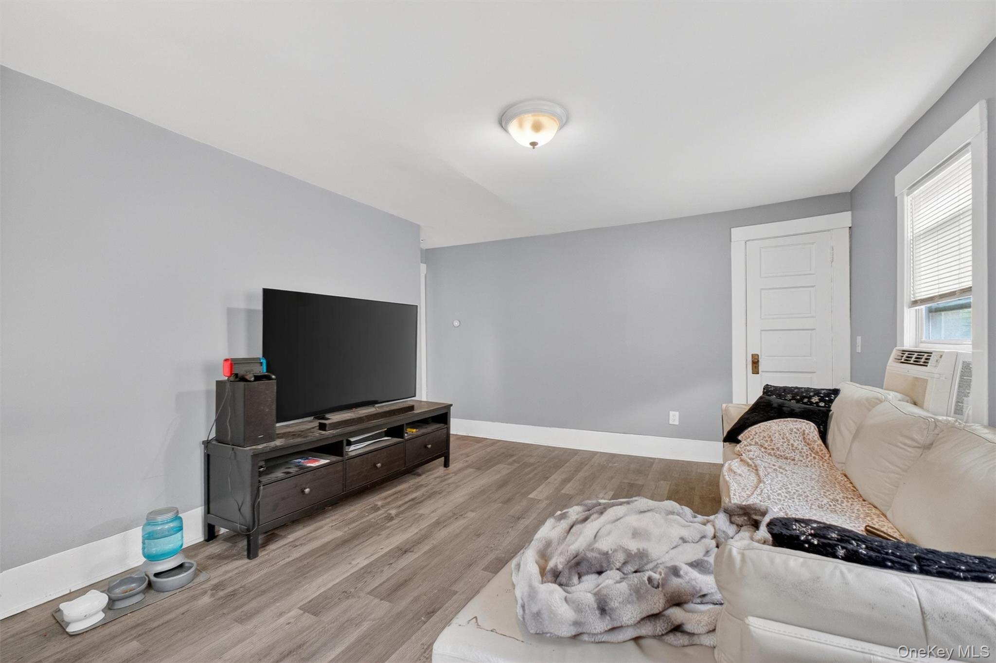 299 Peekskill Hollow Road Putnam Valley, NY 10579 - Photo 24 of 37 a living room with furniture and a flat screen tv