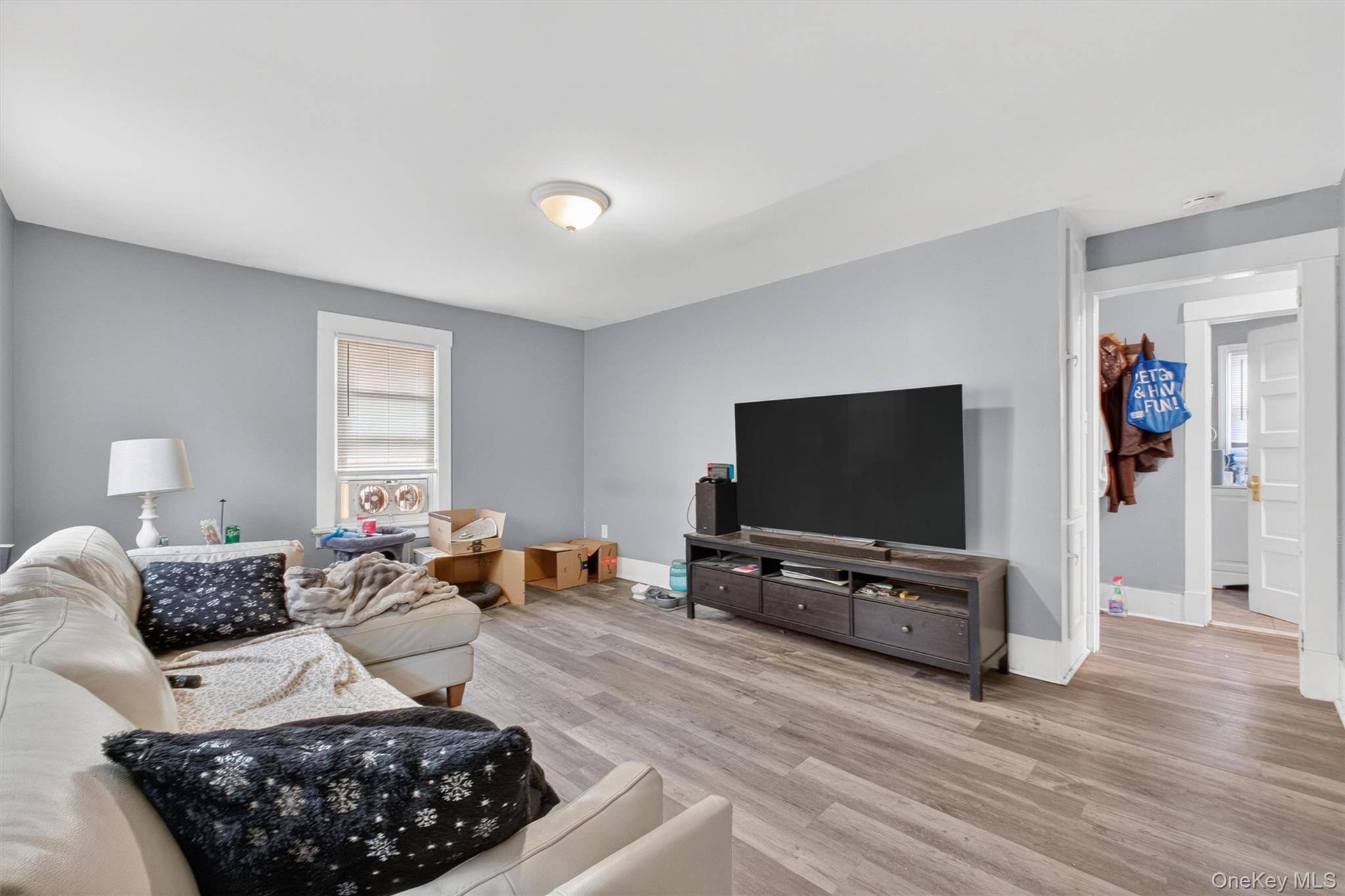 299 Peekskill Hollow Road Putnam Valley, NY 10579 - Photo 25 of 37 a living room with furniture and a flat screen tv