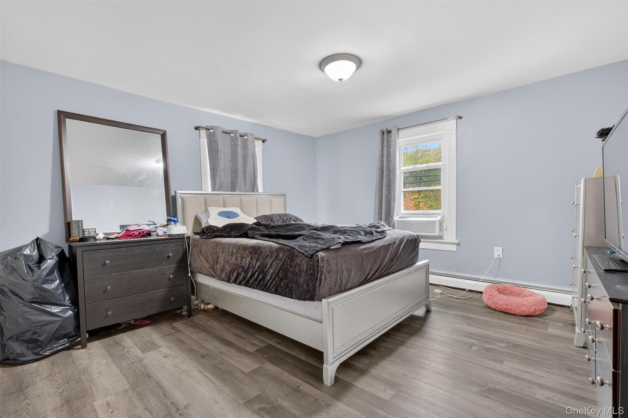 299 Peekskill Hollow Road Putnam Valley, NY 10579 - Photo 28 of 37 a bedroom with a bed and a window