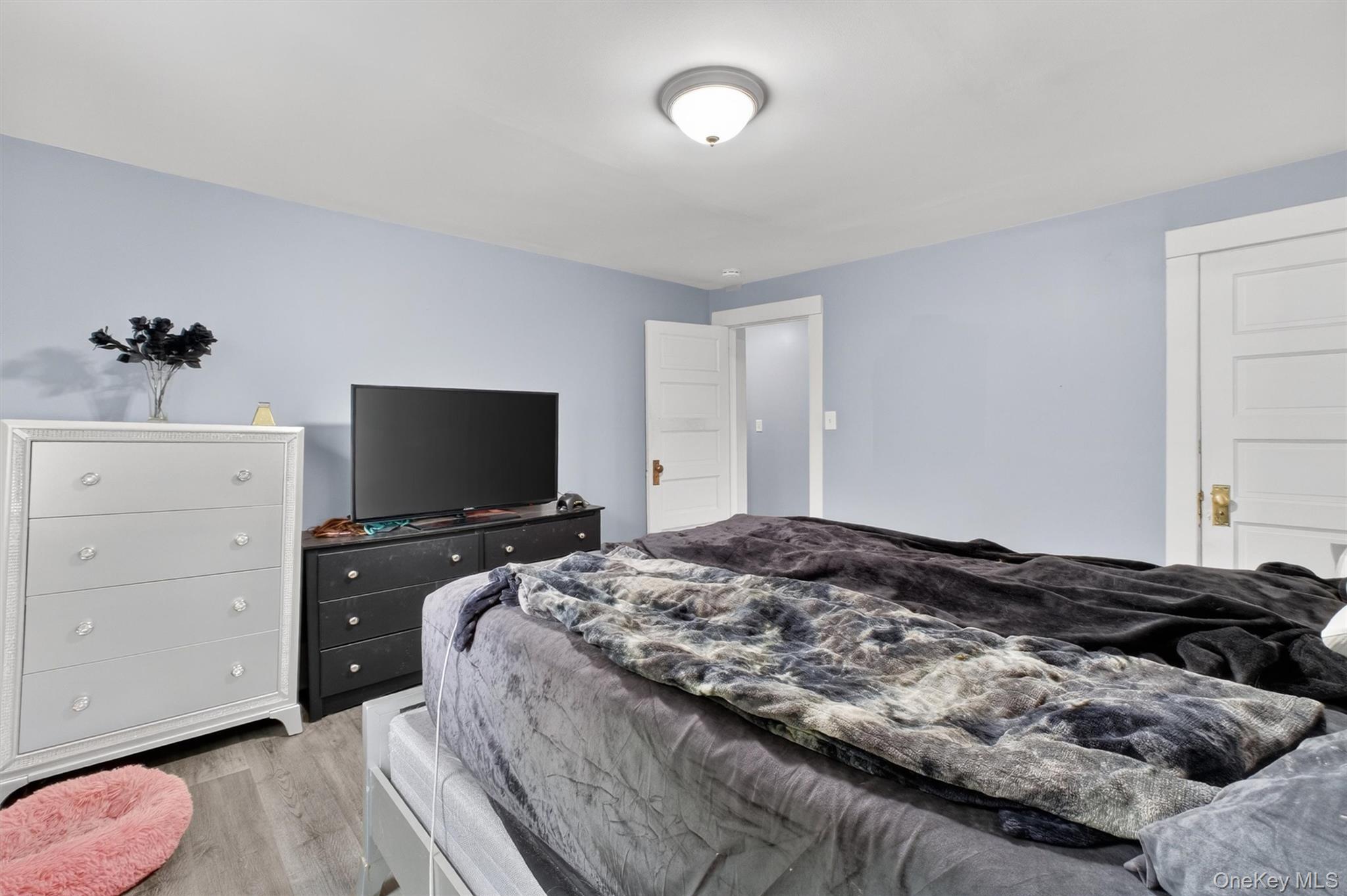 299 Peekskill Hollow Road Putnam Valley, NY 10579 - Photo 29 of 37 a bedroom with a bed and a flat screen tv