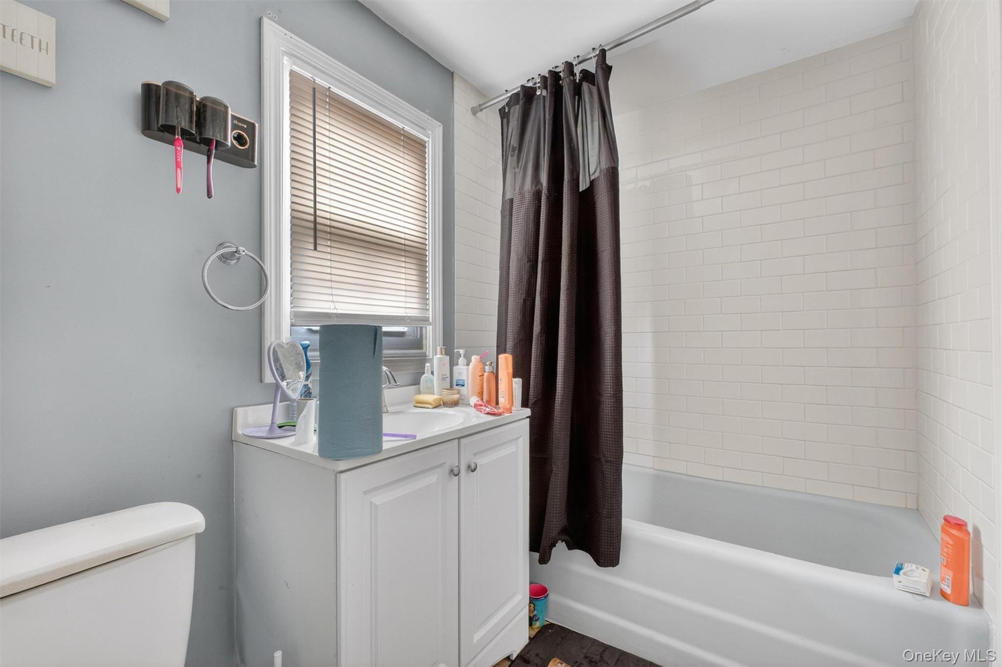 299 Peekskill Hollow Road Putnam Valley, NY 10579 - Photo 32 of 37 a bathroom with a sink toilet and shower