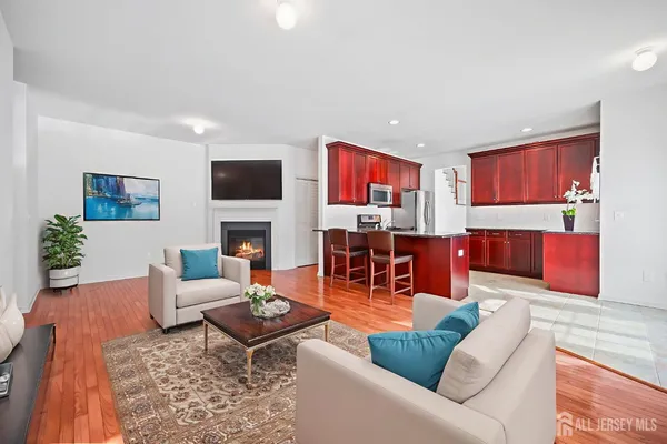 a living room with fireplace furniture and a flat screen tv