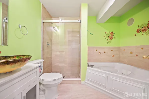 a bathroom with a bathtub toilet and sink