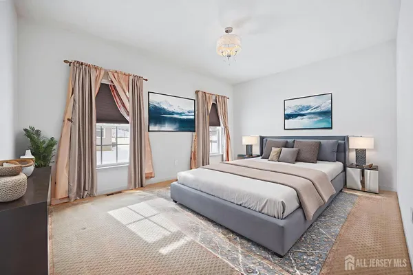 a bedroom with a large bed and a window