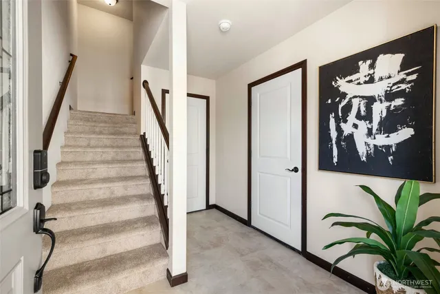 a view of entryway with stairs and wooden floor