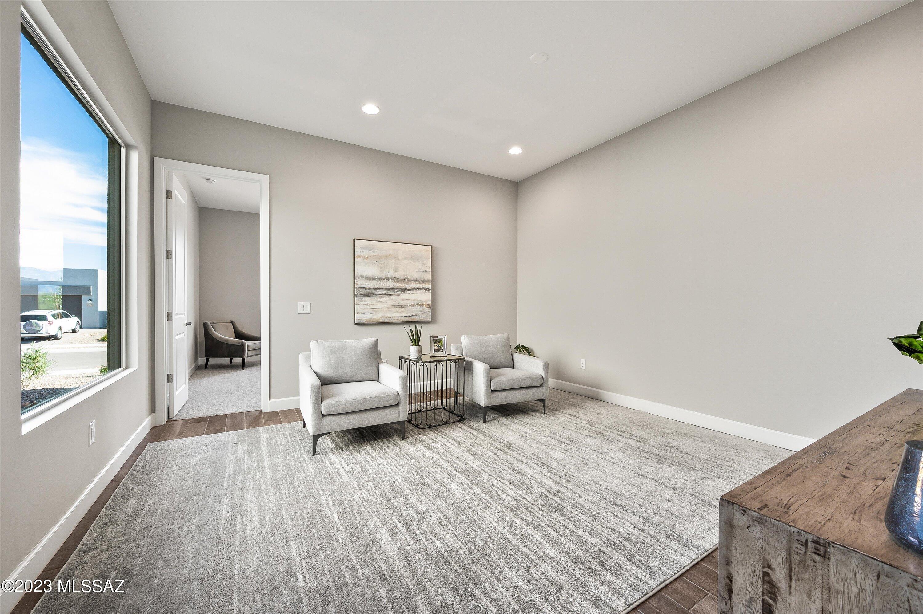 13169 North Vistoso Rnch Place Oro Valley, AZ 85755 - Photo 13 of 29 a living room with furniture and a wooden floor