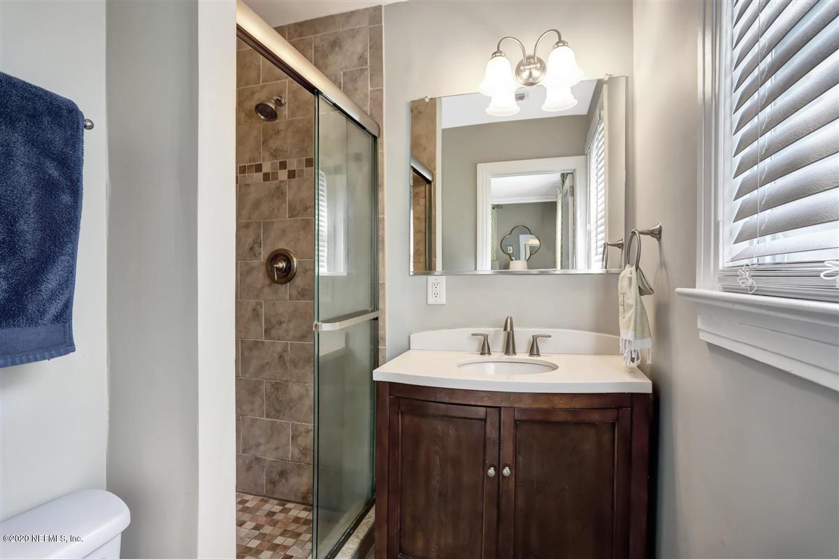 3940 Gadsden Road Jacksonville, FL 32207 - Photo 10 of 17 a bathroom with a sink and a mirror
