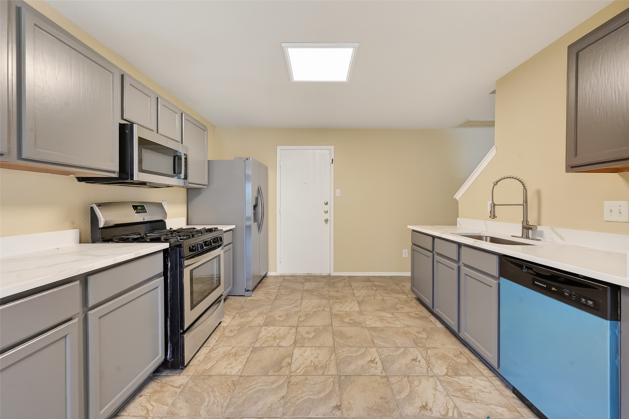 22802 Sherioaks Lane Spring, TX 77389 - Photo 4 of 37 The updated kitchen features great cabinets, white granite counters, SS dishwasher, Gas Stove and Microwave. Sink with modern faucet for clean look. Refrigerator is not included.