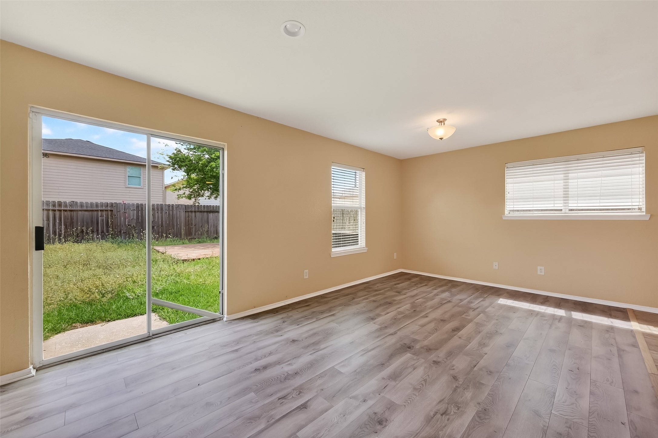 22802 Sherioaks Lane Spring, TX 77389 - Photo 9 of 37 Outdoor patio through sliding glass doors, brining in natural light and creating a great indoor-outdoor flow.