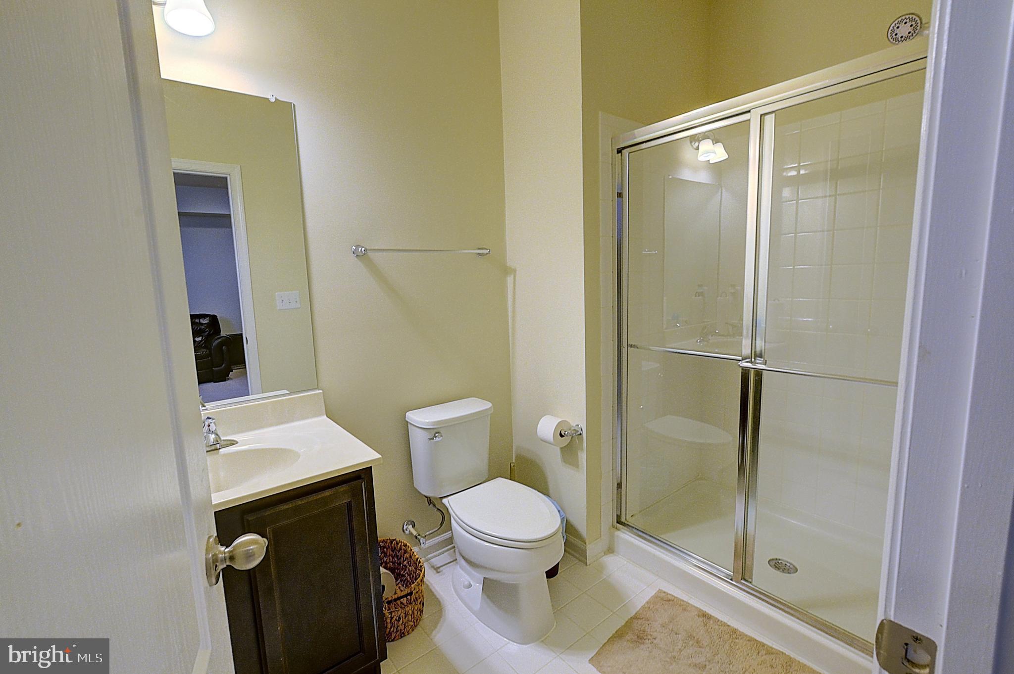 12801 Ricker Road Upper Marlboro, MD 20772 - Photo 14 of 27 a bathroom with a toilet and a shower