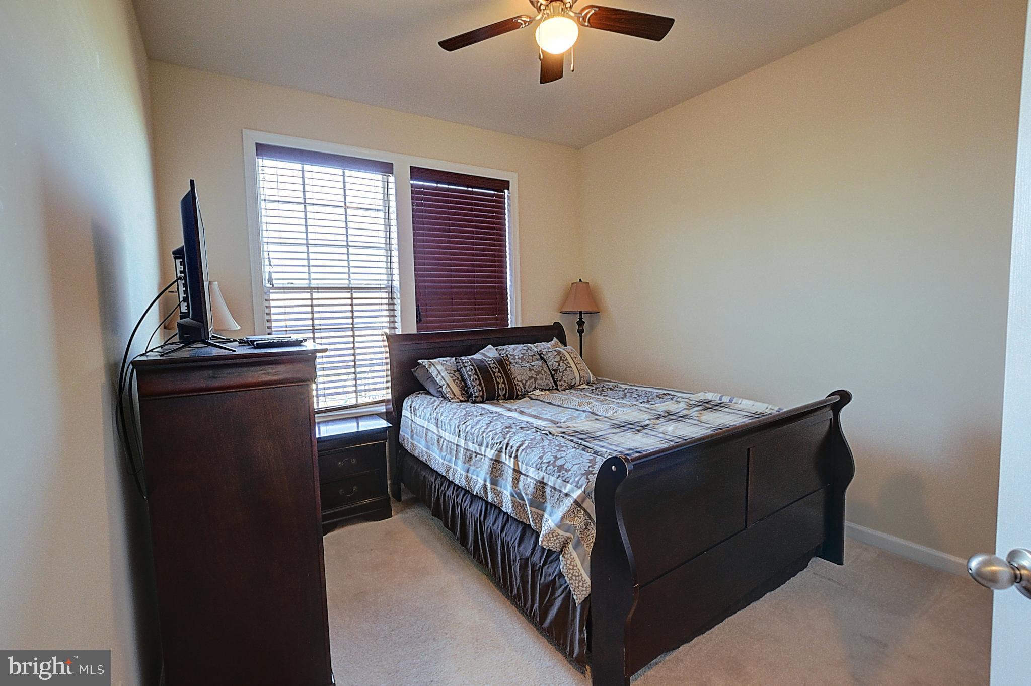 12801 Ricker Road Upper Marlboro, MD 20772 - Photo 21 of 27 a bedroom with a bed and window