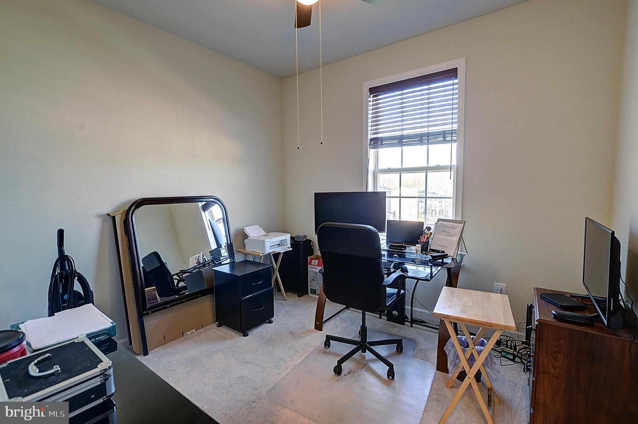 12801 Ricker Road Upper Marlboro, MD 20772 - Photo 24 of 27 a view of a workspace with furniture and a window