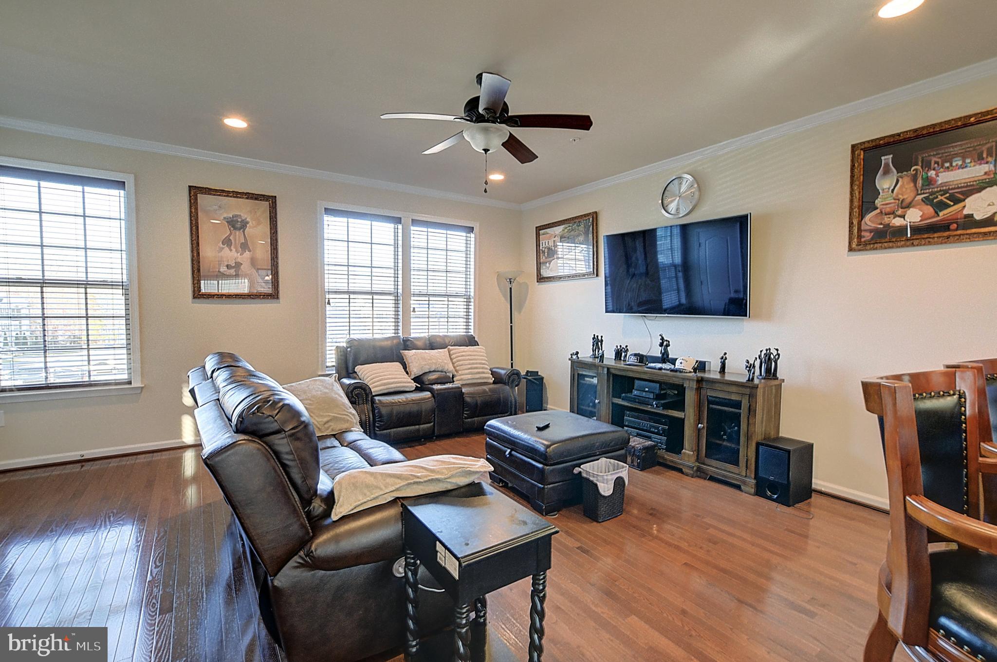 12801 Ricker Road Upper Marlboro, MD 20772 - Photo 4 of 27 a living room with furniture a flat screen tv and a window