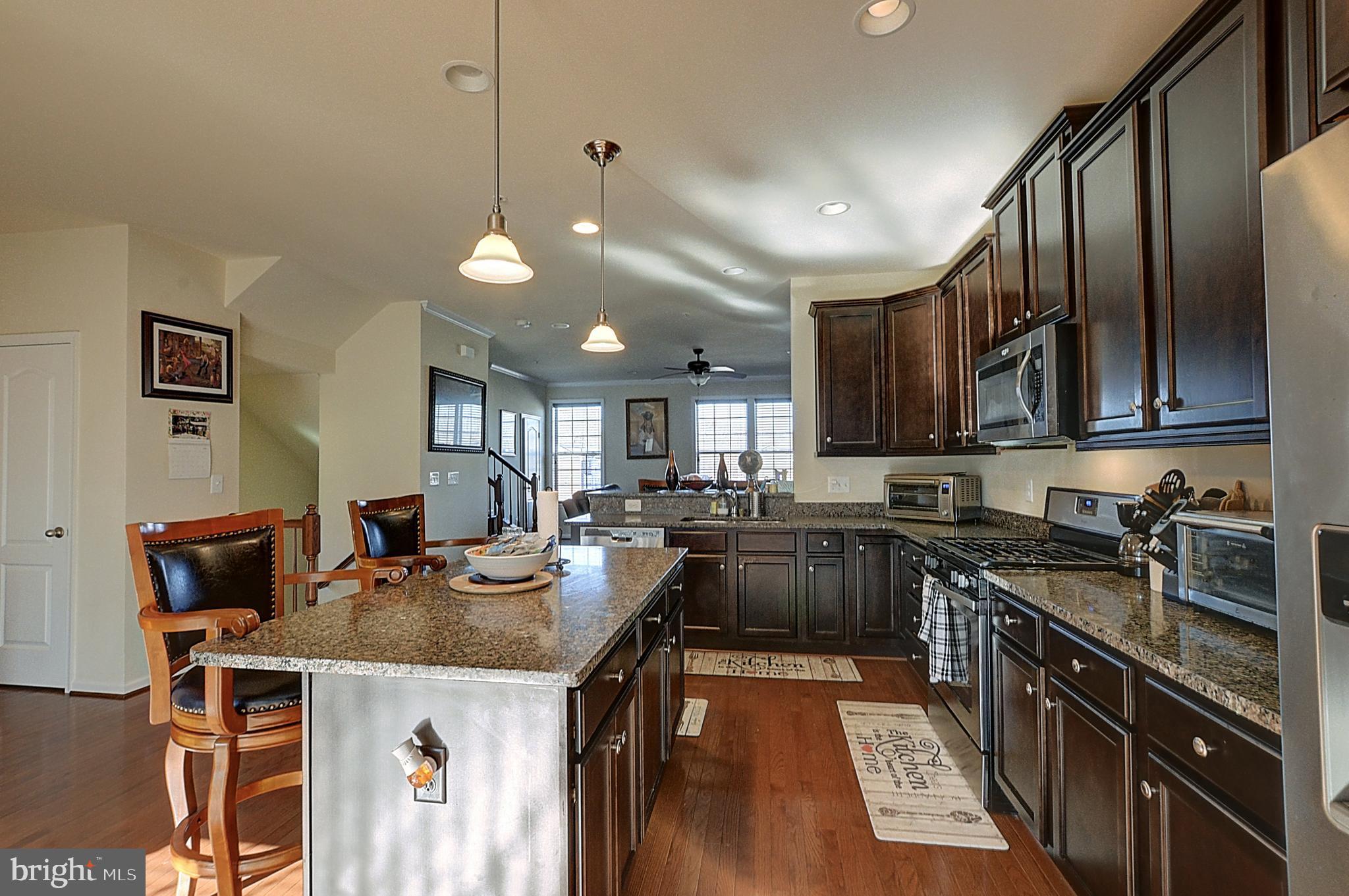 12801 Ricker Road Upper Marlboro, MD 20772 - Photo 10 of 27 a kitchen with granite countertop lots of counter top space appliances and cabinets