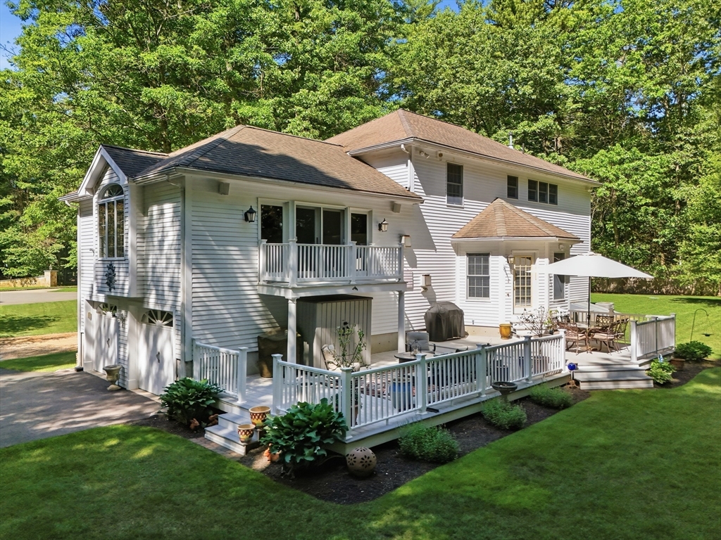 25 Haymeadow Road Boxford, MA 01921 - Photo 30 of 42 a front view of a house with a yard