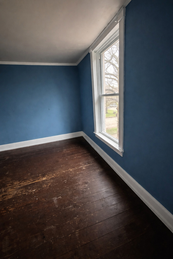 218 South Ida Street Lacon, IL 61540 - Photo 2 of 8 a view of an empty room with a window