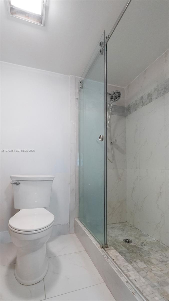 8605 West Sample Road, Unit 202 Coral Springs, FL 33065 - Photo 13 of 26 a bathroom with a toilet and a shower
