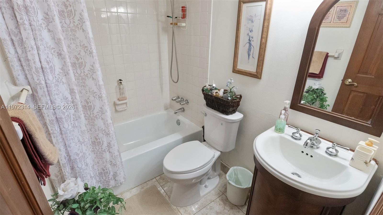 8605 West Sample Road, Unit 202 Coral Springs, FL 33065 - Photo 15 of 26 a bathroom with a sink toilet and shower