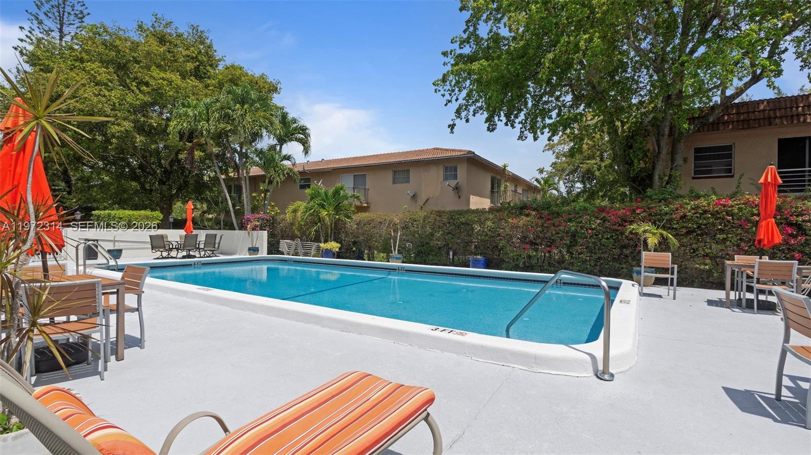 8605 West Sample Road, Unit 202 Coral Springs, FL 33065 - Photo 18 of 26 a view of swimming pool with chairs