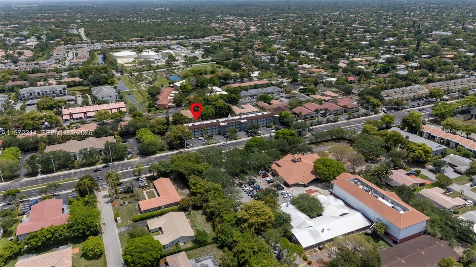 8605 West Sample Road, Unit 202 Coral Springs, FL 33065 - Photo 20 of 26 an aerial view of residential houses with outdoor space