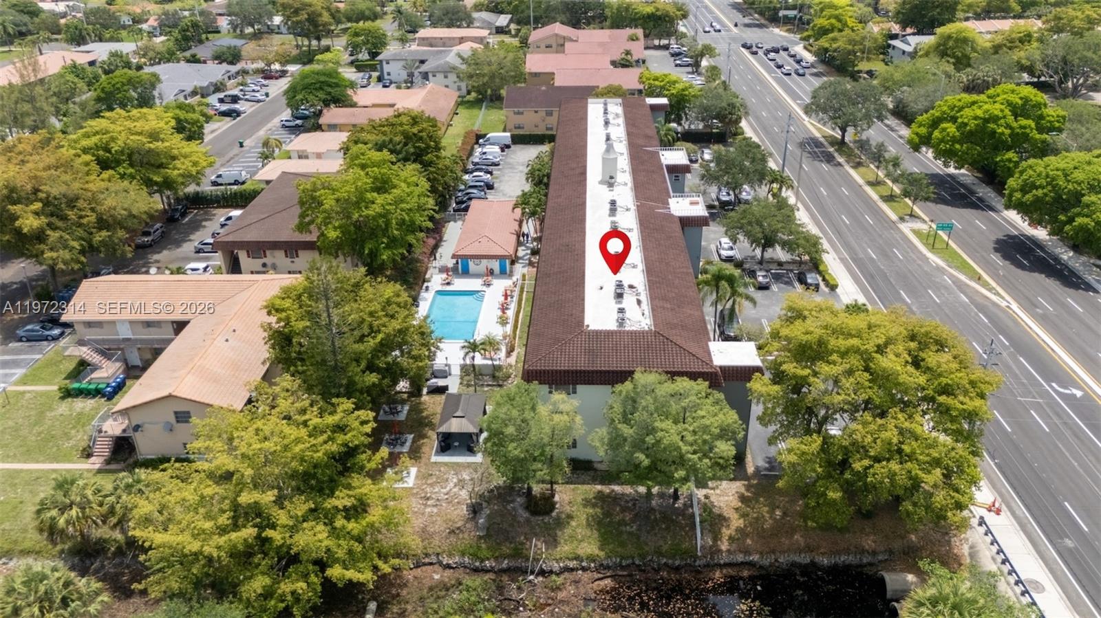 8605 West Sample Road, Unit 202 Coral Springs, FL 33065 - Photo 22 of 26 an aerial view of residential houses with outdoor space