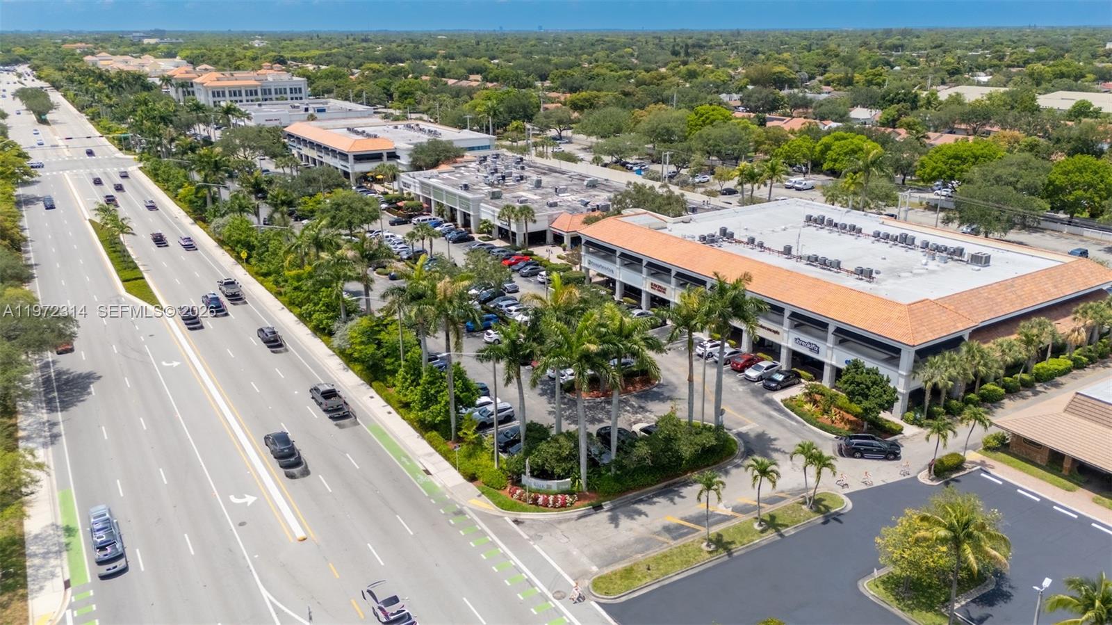 8605 West Sample Road, Unit 202 Coral Springs, FL 33065 - Photo 24 of 26 an aerial view of residential houses with outdoor space and street view