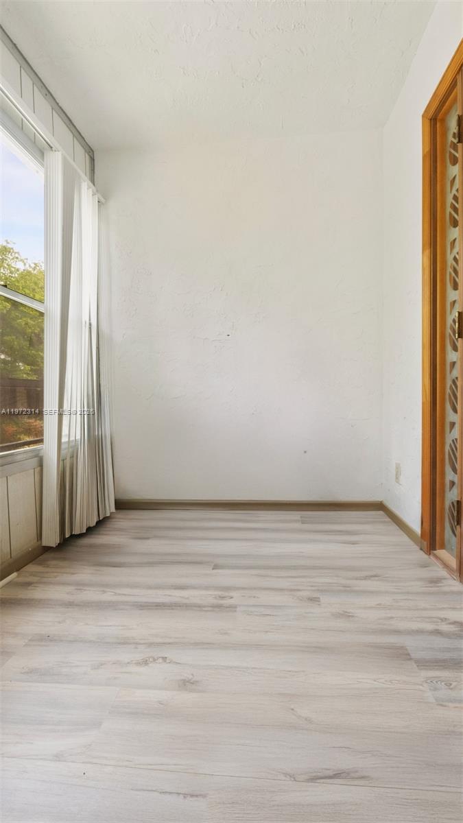 8605 West Sample Road, Unit 202 Coral Springs, FL 33065 - Photo 9 of 26 a view of an empty room with a window