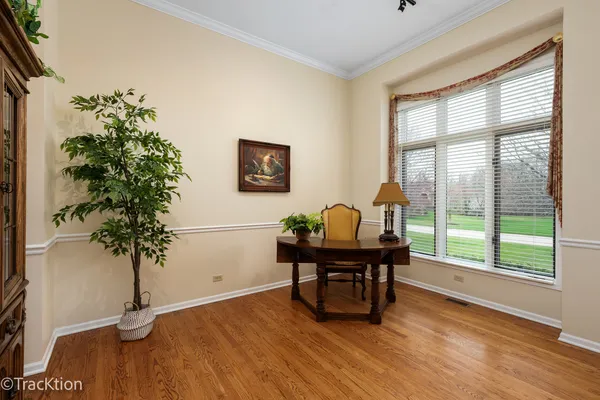 a view of a workspace with furniture and a potted plant