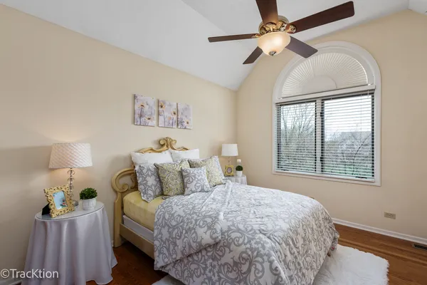 a bedroom with a bed dresser and a window