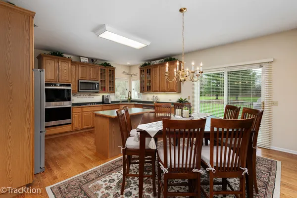 a view of a dining room with furniture window and outside view