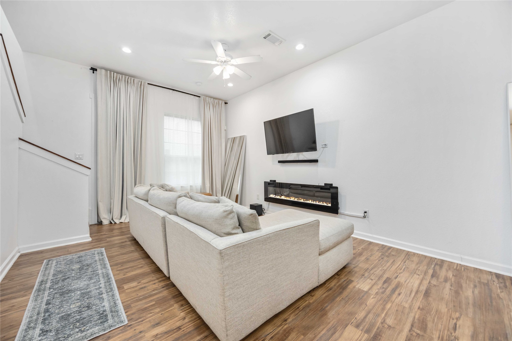 14108 Bridgeport Road, Unit B Houston, TX 77047 - Photo 11 of 24 a living room with furniture and a flat screen tv