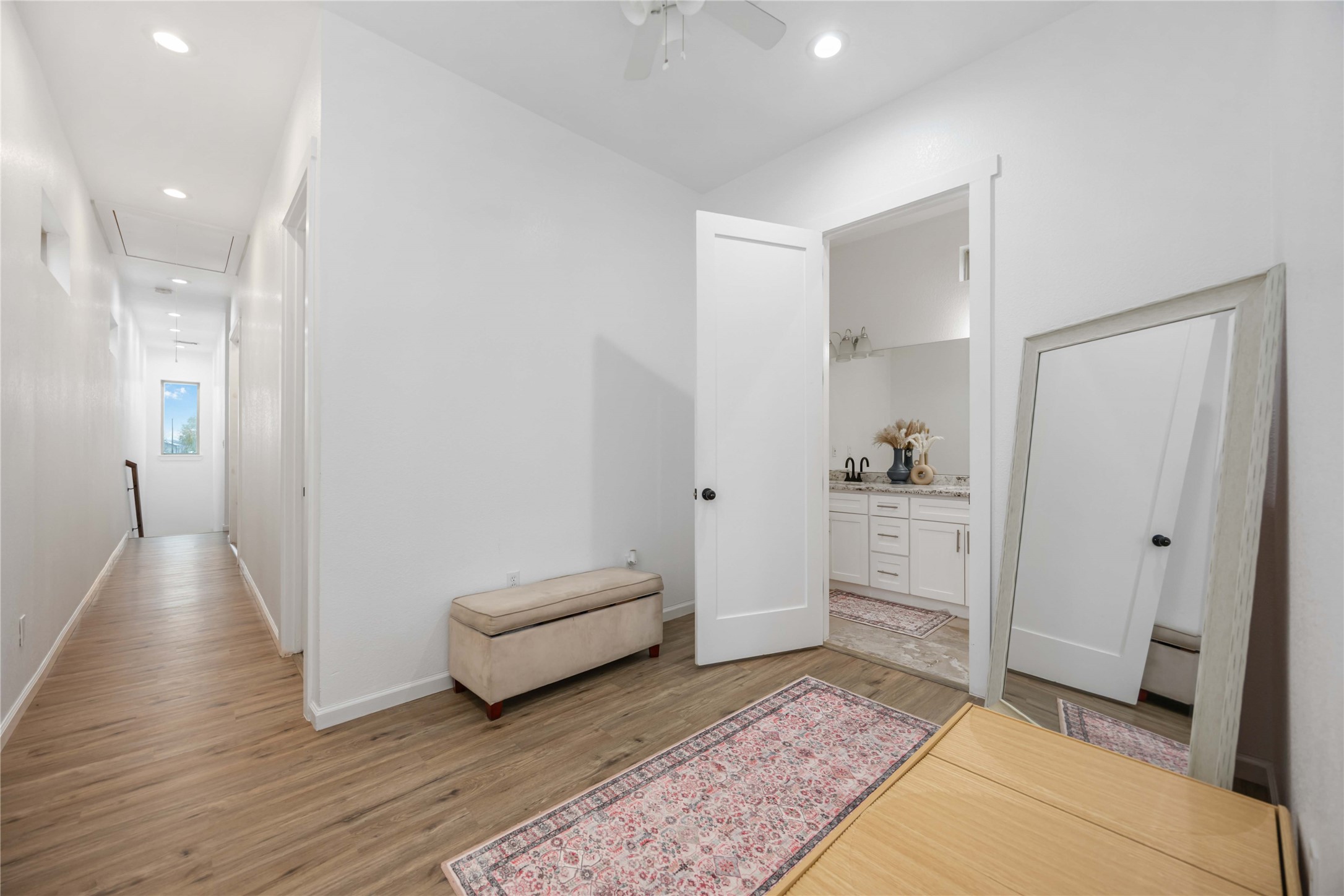 14108 Bridgeport Road, Unit B Houston, TX 77047 - Photo 12 of 24 a view of a hallway with bathroom and wooden floor