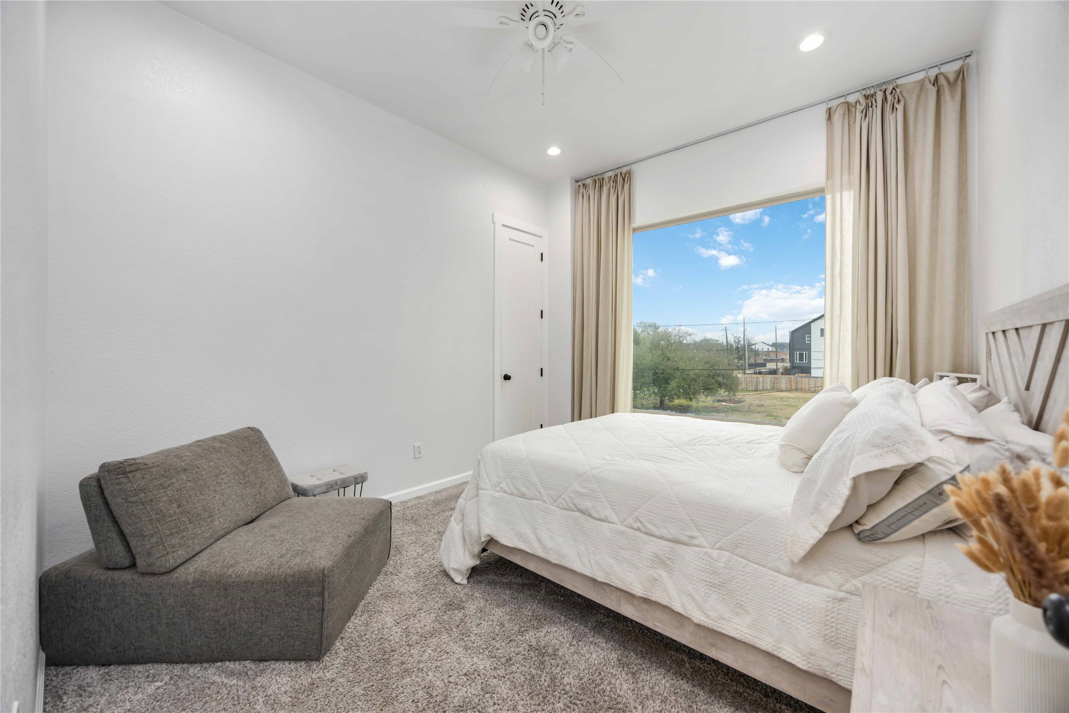 14108 Bridgeport Road, Unit B Houston, TX 77047 - Photo 16 of 24 a bedroom with a bed couch and window