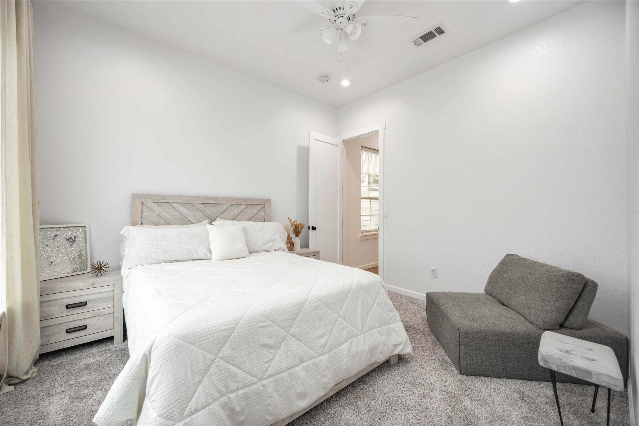 14108 Bridgeport Road, Unit B Houston, TX 77047 - Photo 17 of 24 a bedroom with a large bed and furniture