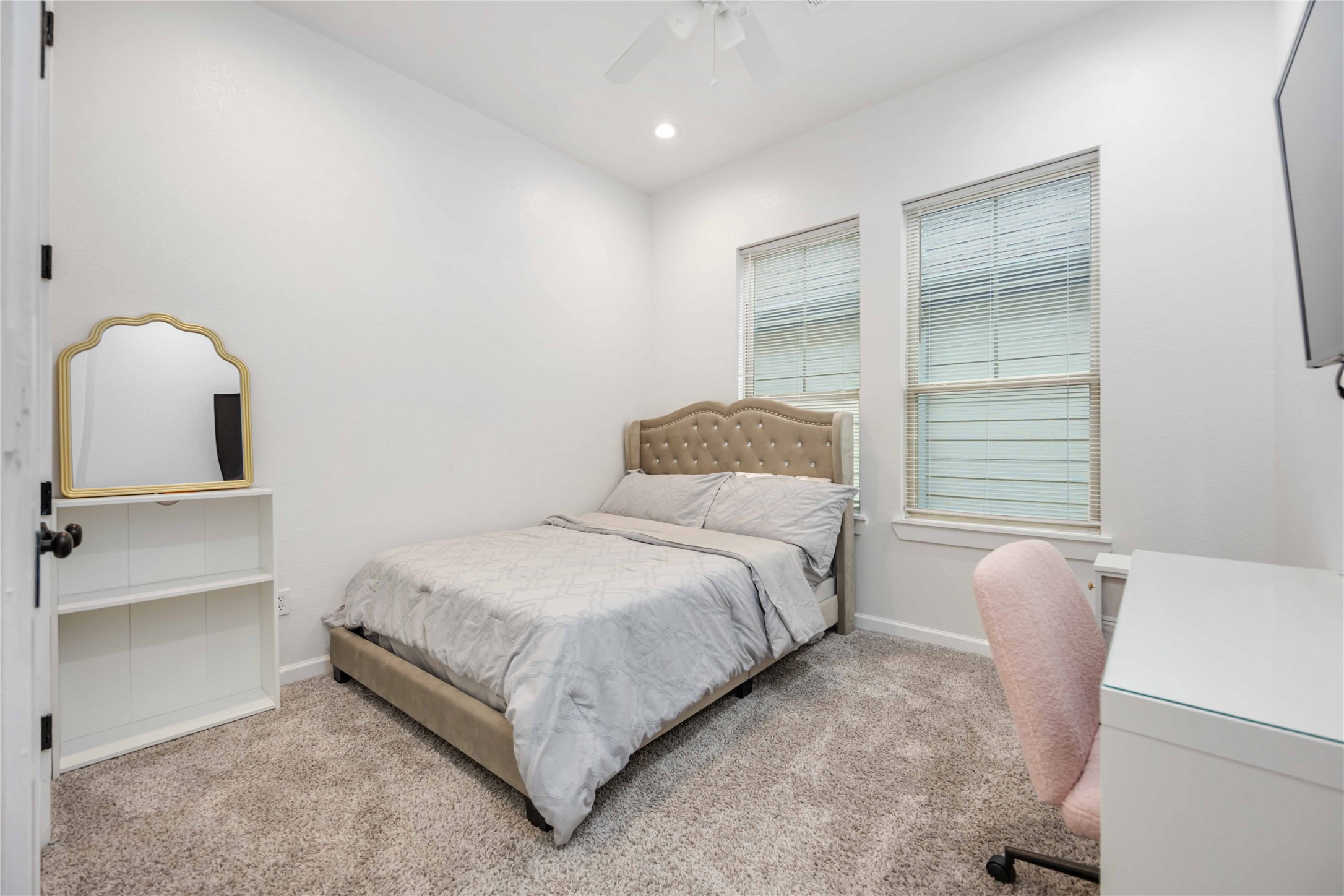14108 Bridgeport Road, Unit B Houston, TX 77047 - Photo 20 of 24 a bedroom with a bed and a dresser