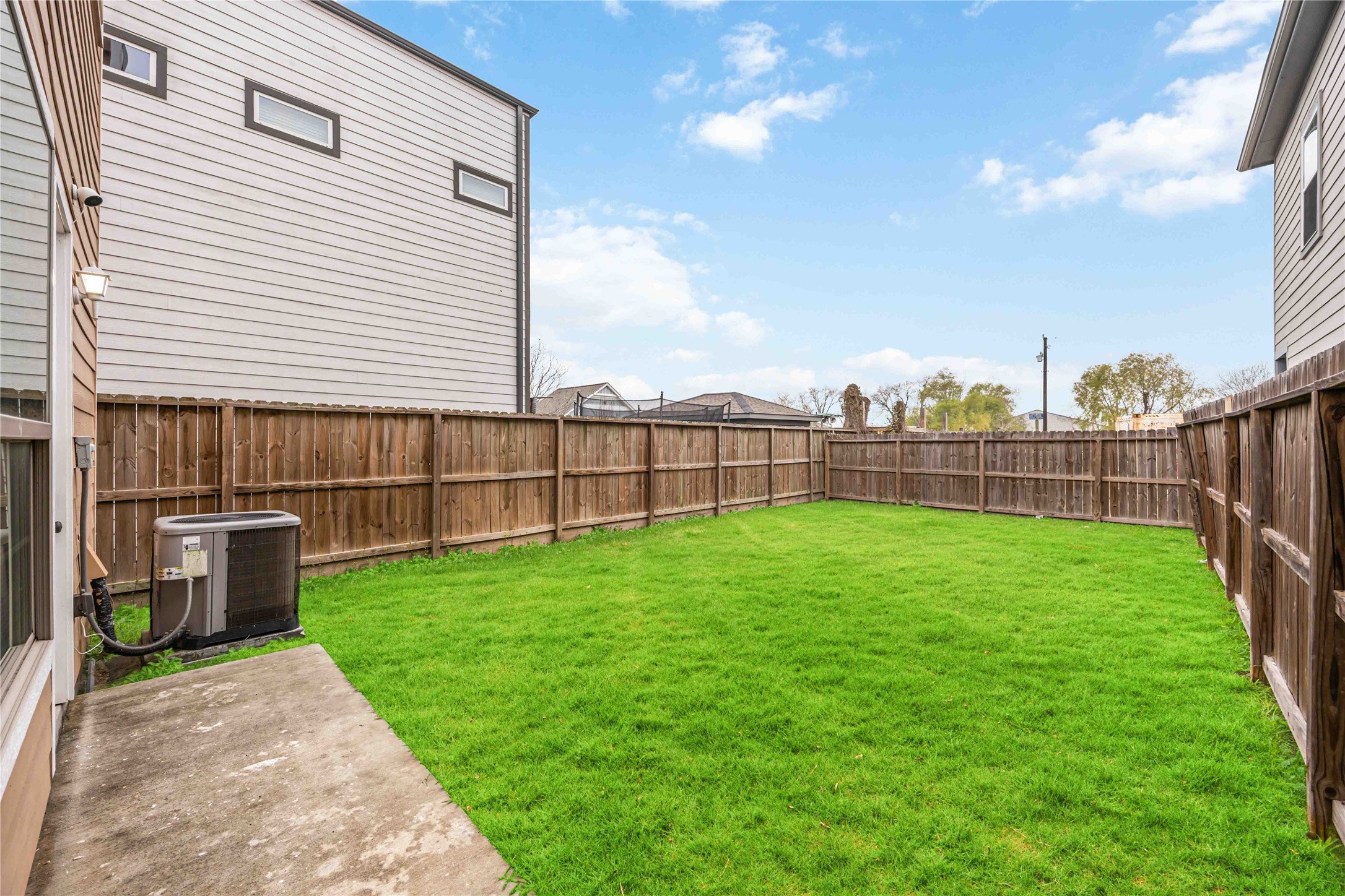 14108 Bridgeport Road, Unit B Houston, TX 77047 - Photo 22 of 24 a view of a backyard with a garden