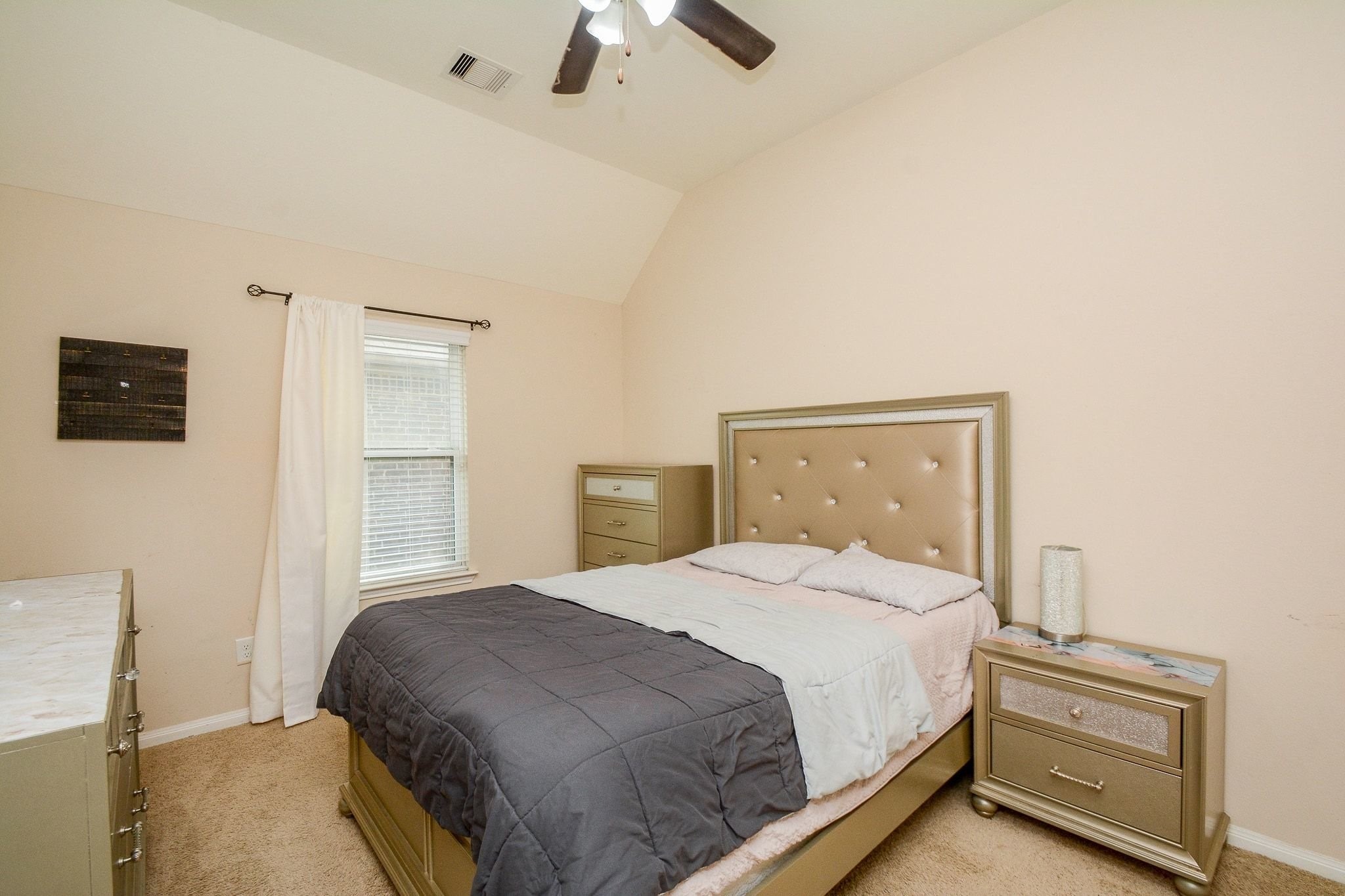 7046 Sliding Rock Circle Spring, TX 77379 - Photo 23 of 41 Cozy upstairs bedroom featuring natural light and elegant furnishings.