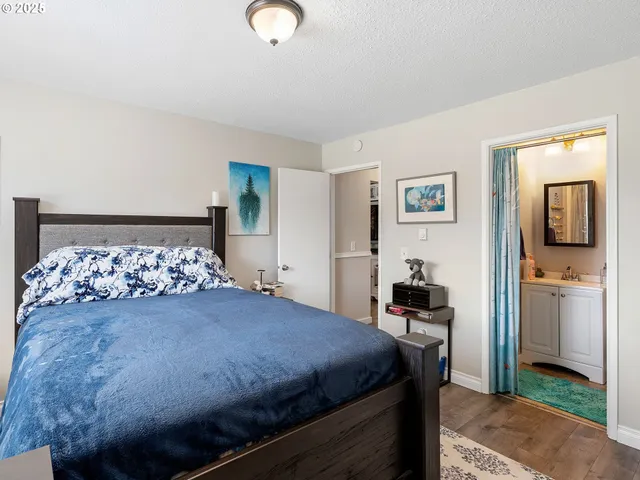 a bedroom with a bed and a television