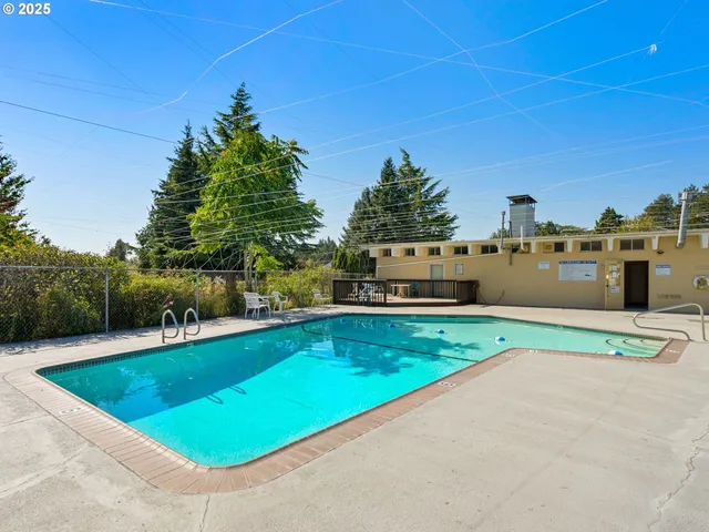 a view of a patio with a table chairs and a patio