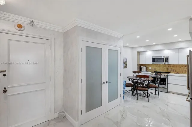 a view of a livingroom with furniture and a window