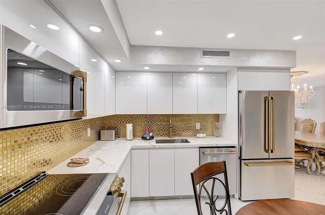 a kitchen with a refrigerator and a microwave