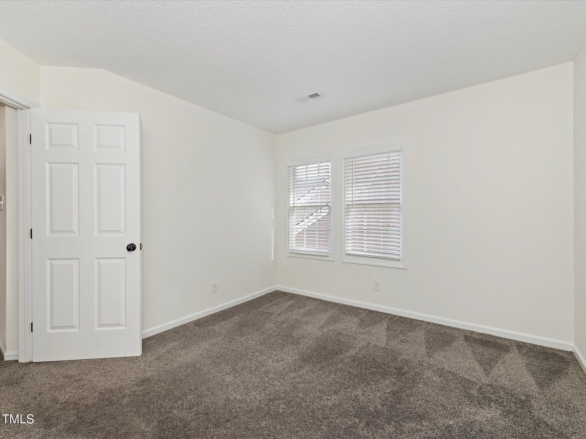 104 Deep Gap Run Cary, NC 27519 - Photo 22 of 39 a view of an empty room with a window